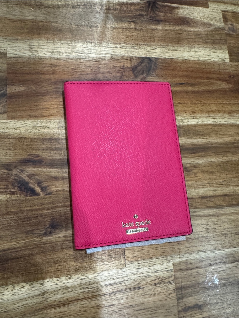 kate spade pink textured passport cover with gold logo